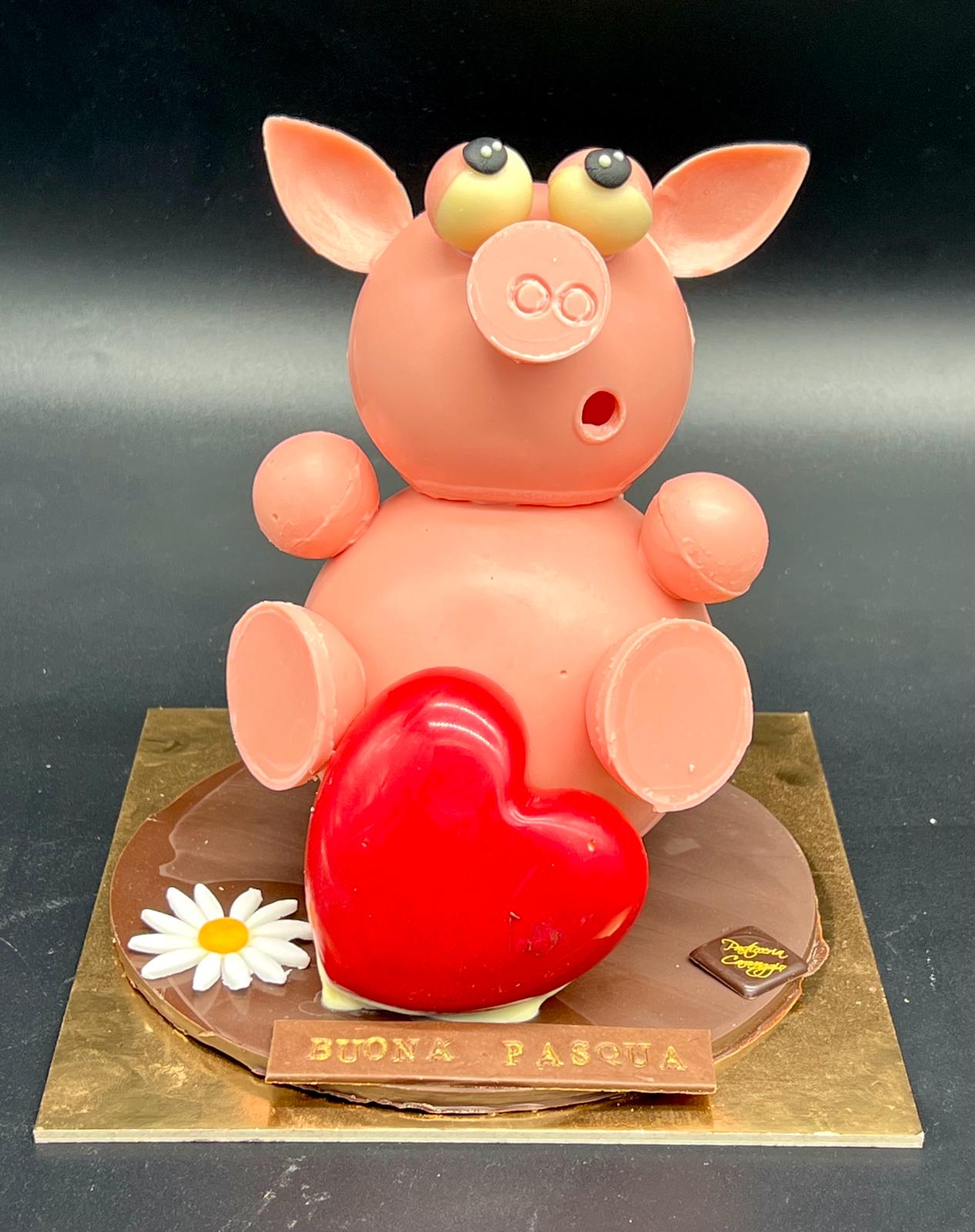 Statuina di cioccolato a forma di maialino con cuore, pasticceria Caravaggio Pasqua 2024